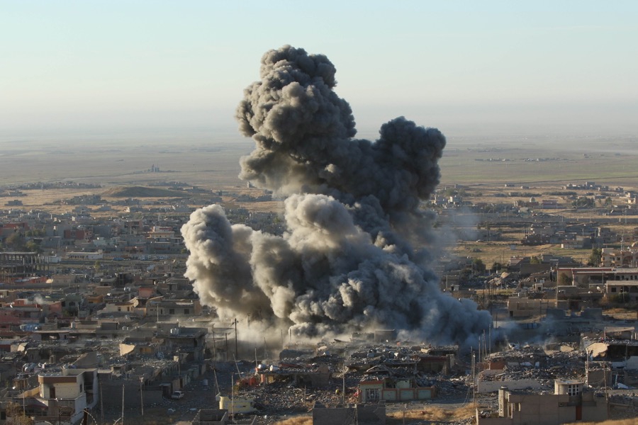 Smoke rises from the site of US-led airstrikes in the town of Sinjar on Nov. 12, 2015. Smoke rises from the site of US-led airstrikes in the town of Sinjar on Nov. 12, 2015.